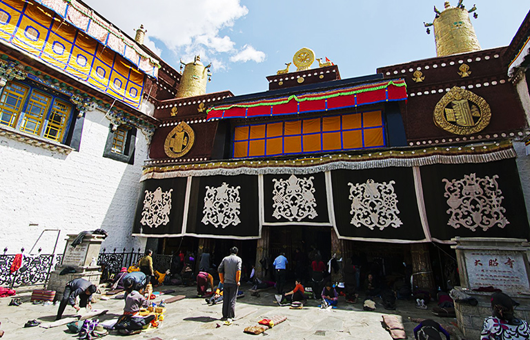 Jokhang Temple with Pilgrims Praying